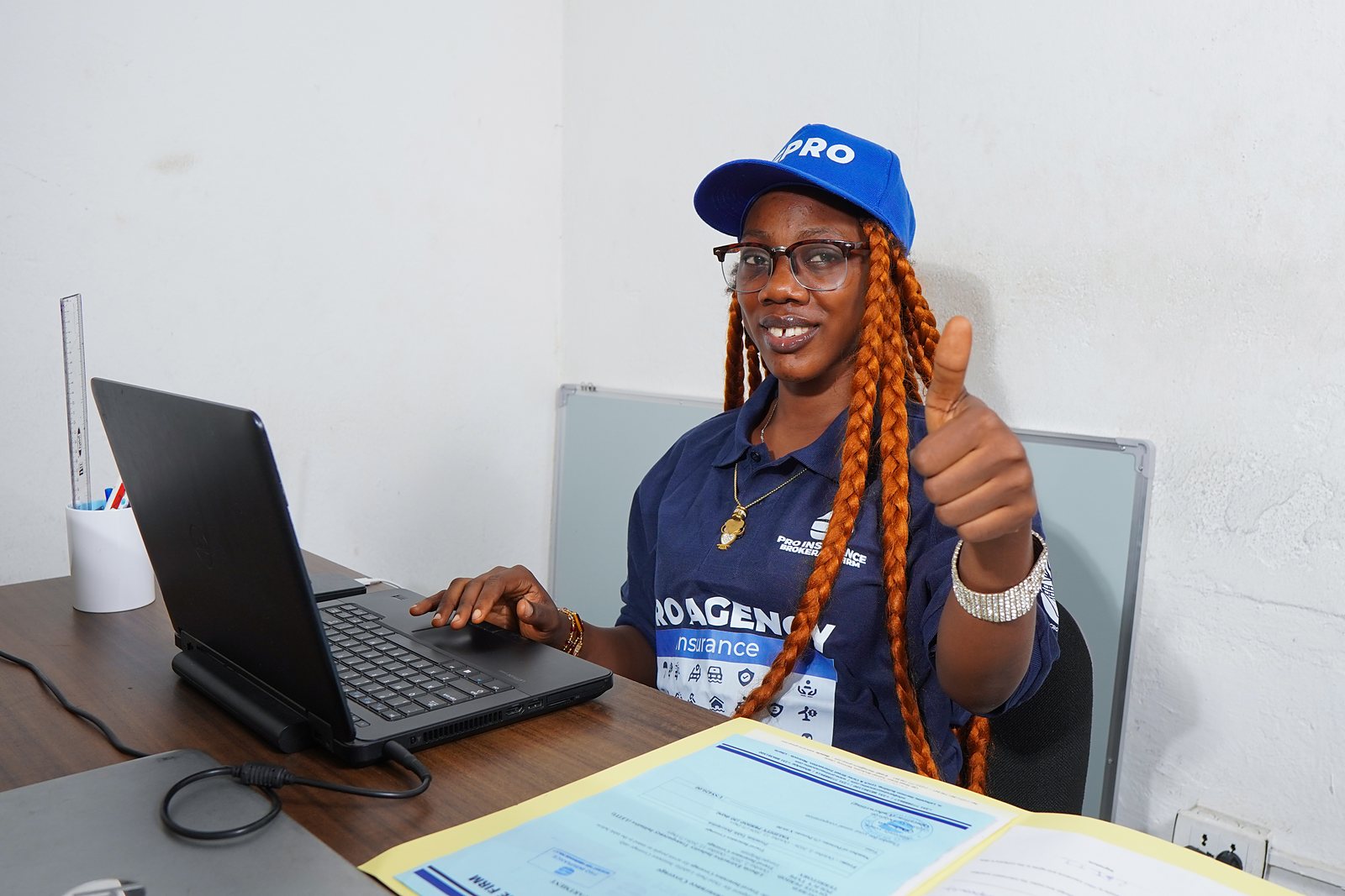 A Pro-Insurance adviser at her desk, ready to help with a client enquiry