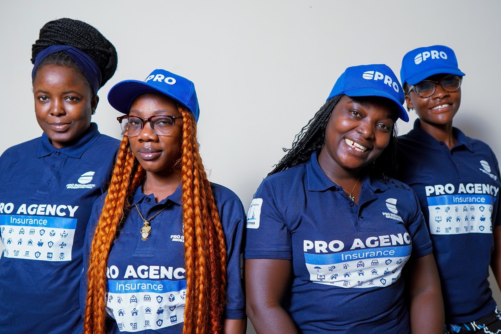 The Pro-Insurance Brokerage Firm team in branded uniform at the firm's Monrovia office